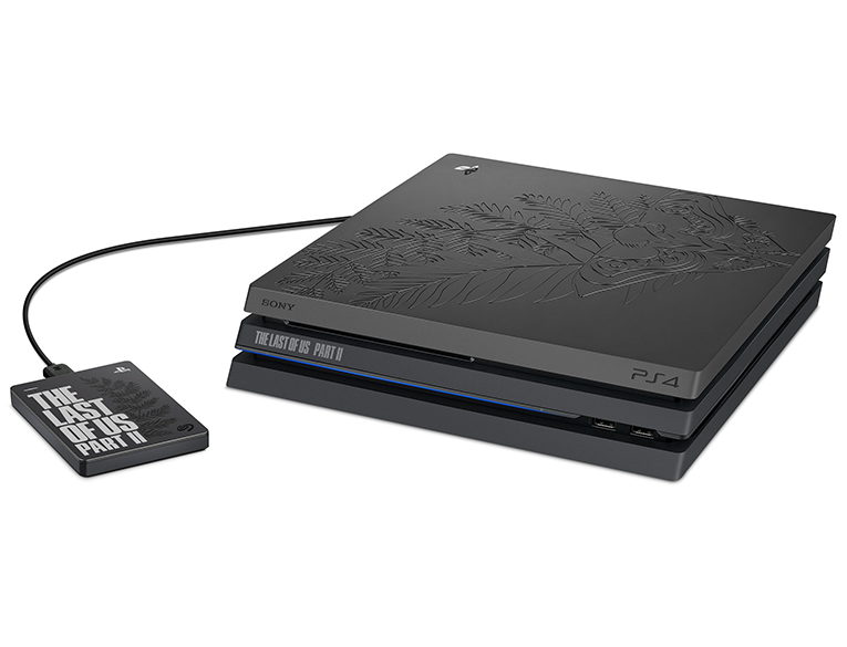 The bundle includes a Sony PS4 Pro console with matte finish and engraved Ellie's tattoo design